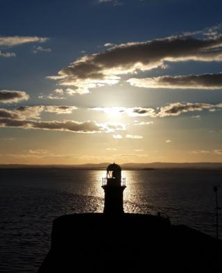 Sunset over a lighthouse