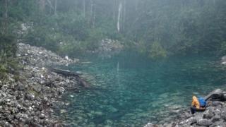 The Disappearing Tarn filled with blue-green water on Mt Wellington in Tasmania