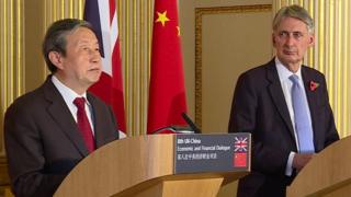 Ma Kai and Philip Hammond