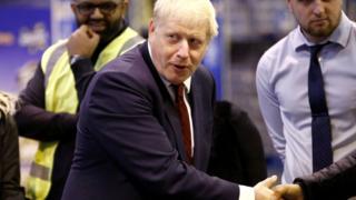 Boris Johnson visiting a business in Manchester