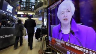 Federal Reserve Chair Janet Yellen"s Washington news conference is shown on a television screen on the floor of the New York Stock Exchange