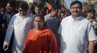 Indian Union Minister for Water Resources, River Development and Ganga Rejuvenation Uma Bharti (C) takes part in a rally in Kolkata on October 31, 2015.