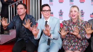 The actors of Big Bang Theory pose during the ceremony of the imprint