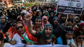 Indian Muslim women protesters shout slogans during a protest against the Citizenship Amendment Act (CAA) and National Register of Citizens (NRC), in Mumbra on the outskirts of Mumbai, India, 26 January 2020.