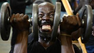 A man lifts weights as he works out at the Kaloleni gym, in Nairobi, Kenya - Wednesday 9 January 2019