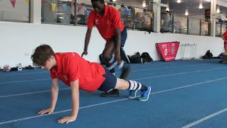 Young rugby players carry out some of the targeted exercises