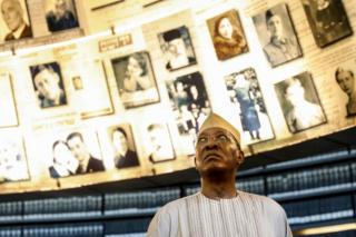 Chadian President Idriss Deby looks at images of Jewish Holocaust victims at the Names Hall during his visit to the Yad Vashem Holocaust Memorial Museum in Jerusalem, Israel - November 26, 2018