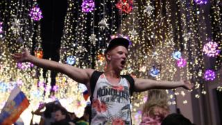   Russian fans celebrate their victory in the 2018 World Cup against Spain in the center of Moscow 