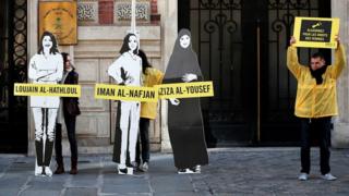 Demonstrators from Amnesty International stage the protest on International Women’s day