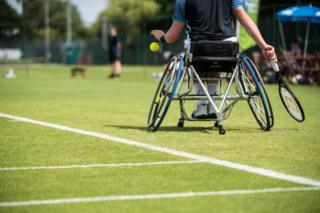 Alfie Hewett prepares to serve