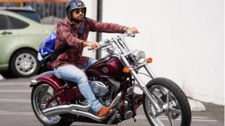 Actor Jesse Metcalfe riding a Harley-Davidson