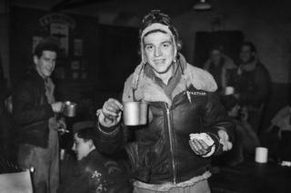 Sergeant Leo Teetman Jr celebrates New Year's Eve, 1943, with a post-mission sandwich and coffee