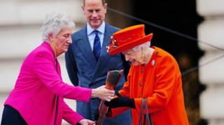 Queen with baton