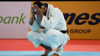 Iranian judoka Saeid Mollaei with his head in his hands