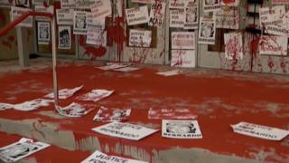 Protesters covered the street and prosecutors steps with red paint in July