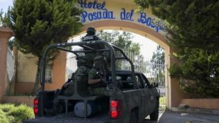 Mexican soldiers guard the funeral of Ocampo municipality Mayor and candidate for the Democratic Revolutionary Party (PRD), Fernando Angeles, in Ocampo, Michoacan State, Mexico, on June 21, 2018.