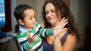 A young patient at St Jude Children's Research Hospital, with his mother