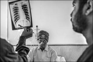 Doctors at the Chirayu Cancer Hospital in Bhopal examine a patient who lives near to the abandoned plant.