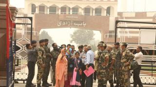 Fatima, Mumtaz and Hina wave as they enter Pakistan through the Wagah border