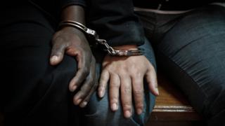 A Chinese and Kenyan national sit handcuffed in a court in Nairobi, Kenya - Wednesday 9 January 2019