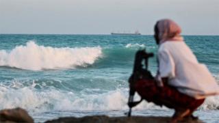 A Somali pirate watching near Hobyo, Somalia