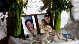 Candles, flowers and photos are placed outside the hospital where former Salvadorean president (1999-2004) Francisco Flores was declared dead, in San Salvador on January 31, 2016.