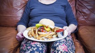 obese woman eating