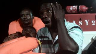 A picture from the NGO SOS Méditerranée shows migrants being rescued before boarding the Aquarius