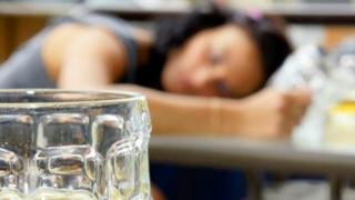 Drunk student with beer glass