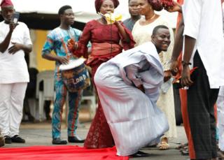 A groom dances at his traditional wedding at the Ikeja marriage registry in Lagos, Nigeria, May 5, 2018.