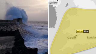 A wave hits a coastal wall in Porthcawl, Bridgend county