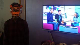 Awais from Bradford is Freddy from 'Five Nights at Freddy's'. Also, that looks like a great programme on your TV!