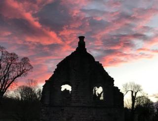 Sunrise over a building