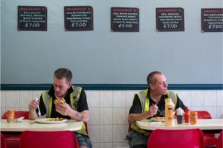 Two men eating