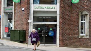 Lady walks out of Laura Ashley