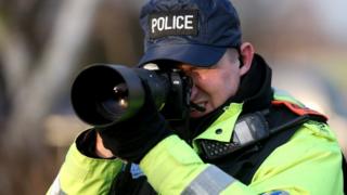 Police officer taking a picture