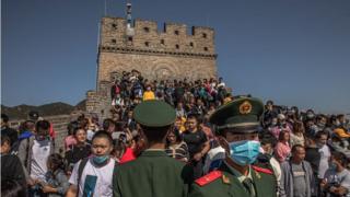 Dozens of people are seen on the Great Wall of China