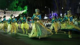 Dancers dressed as genies take part in the annual parade in Medellín