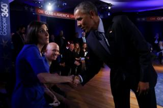 US President Barack Obama greets Taya Kyle, widow of US Navy Seal Chris Kyle in Fairfax, Virginia, 7 January