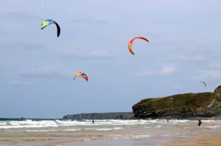 Kite surfers on a beach