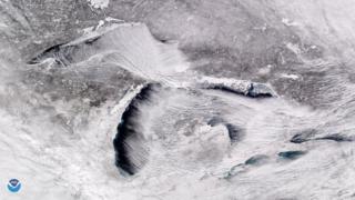 Satellite image taken over the Great Lakes showing parallel rows of cumulus, also known as 