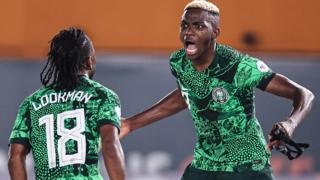 Victor Osimhen and Ademola Lookman celebrate a goal for Nigeria against Cameroon