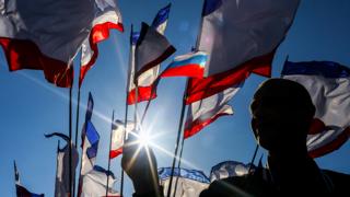 Children hold Crimean flags at Lenin Square in Simferopol, Crimea, Ukraine, 15 March 2014.