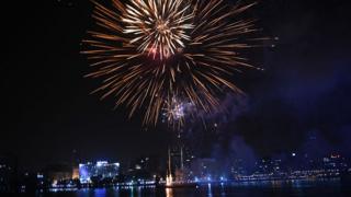 Fireworks light up night sky over Abidjan cityscape