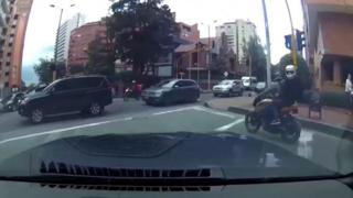 Dash cam footage of a car chasing thieves on a motorbike