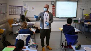 Pupils at a bi-lingual school in north London back in class