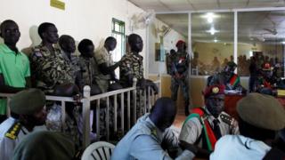 South Sudanese soldiers stand during their sentencing over the rape of foreign aid workers and the murder of a local journalist in an assault on the Terrain Hotel in the capital Juba in 2016 at a military court Juba, South Sudan, September 6, 2018.