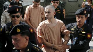Suspects of the August 17 Bangkok blast, Bilal Mohammed (also known as Adem Karadag) and Yusufu Mieraili are escorted by soldiers and prison officers as they arrive at the military court in Bangkok, Thailand, 24 November 2015