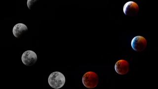 A composite photo shows all the phases of the so-called Super Blood Wolf Moon total lunar eclipse on Sunday January 20, 2019 in Panama City.