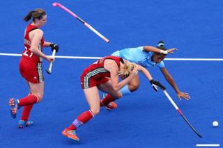 Leah Wilkinson of Wales clashes with Rani of India during a hockey match